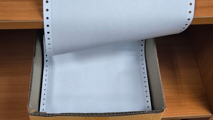 Continuous length paper for dot printers