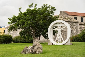 Statue resembling Vitruvian Man of Leonardo da Vinci in Havana, Cuba in front of Castillo de la...