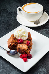 tasty brownie with cappucino on tabe