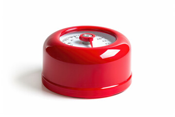 Red kitchen timer on a white background.