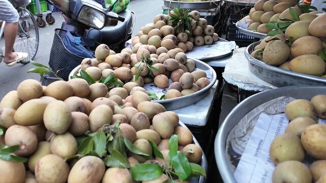 Sapodilla fruit or sam po che or hong xiem, Vietnamese tropical agiculture product on cart for sale at outdoor fruits market, Cho Lon, Ho chi Minh city, Vietnam