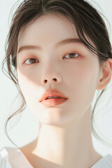 Portrait of a Young Woman with Clear Skin and Elegant Makeup, Featuring Natural and Subtle Beauty