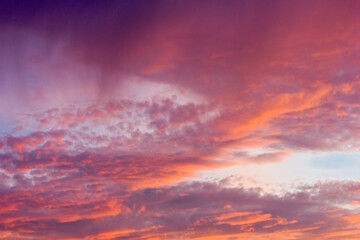 Bright magenta clouds in the evening sky. A colourful sunset.