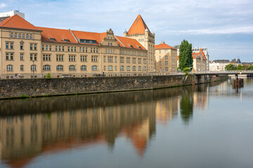 Fototapeta premium Buildings of Berlin standing near the river are reflected in the water. Embankment of Berlin.