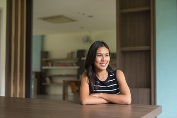 Portrait of Beautiful Asian Woman Sitting Indoors in Coworking Space Style Library Office