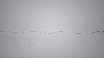 Small cracks on the white wall