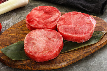 Delicous raw tuna medallion for cooking