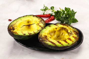 Sliced fresh avocado on the grill