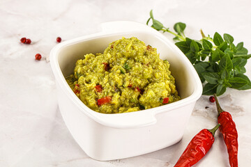 Guacamole with avocado, tomato and chili