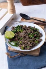 An Egyptian food hawawshi or hawawshy is a classic of spiced meat baked in bread served with tahina
