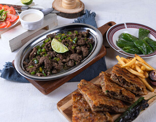 An Egyptian food hawawshi or hawawshy is a classic of spiced meat baked in bread served with tahina

