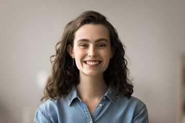 Head shot beautiful positive young woman having attractive appearance, optimistic mood and perfect...