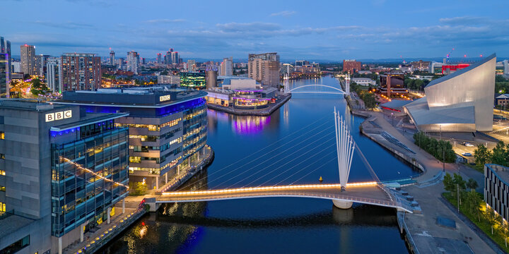 Salford Quays, Manchester, England,. Ariel view of Salford Quays, waterfront, Imperial War Museum, BBC Studios and the Lowry. Skyline of Manchester and Old Trafford