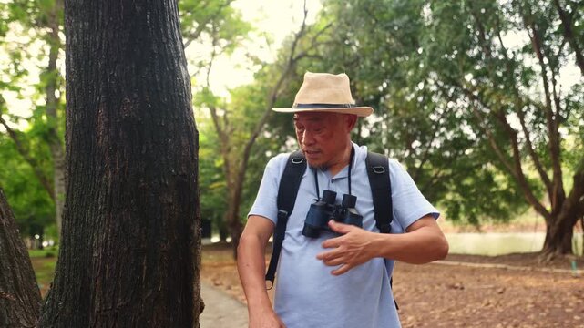 Retired male tourist was happily using binoculars watch birds in a park. He accidentally leaned against tree where red fire ants poisonous bit his arm causing burning itchy pain in his arm.