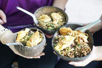 Food in coconut shell bowls. Concept, eco friendly kitchenwares. Reusable and natural material for containing food. Healthy and safety eating lifestyle.        