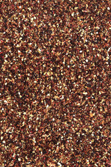 Fruit tea, texture. Top view of tea made from apple, cinnamon, lemon zest, hibiscus flowers, licorice root and cloves. Tea composition. Ingredients for a hot drink, close-up. Flat tea background