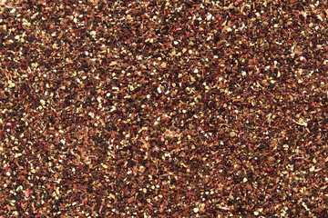 Fruit tea, texture. Top view of tea made from apple, cinnamon, lemon zest, hibiscus flowers, licorice root and cloves. Tea composition. Ingredients for a hot drink, close-up. Flat tea background