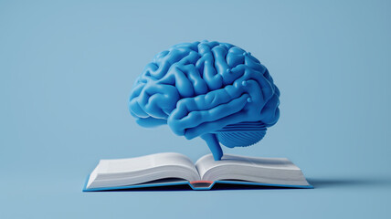 A blue human brain model placed on an open book, floating against a light blue background, symbolizing the connection between knowledge, learning, and cognitive functions.