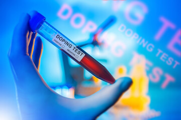 Doping test. Flask with athlete blood in his hand. Doping test in laboratory. Analysis for presence of prohibited drugs in body. Doping test for participants in sports competitions.