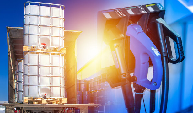 Transportation of gasoline. IBC with fuel loaded into truck. Pistols from gas station. Plastic containers for transporting fuel. Delivery of gasoline in IBC containers. Shipment of petroleum products