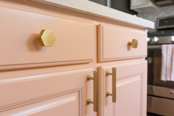 pink painted cabinets with high end brass hardware - modern contemporary painted cabinetry in the kitchen