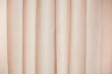 Fototapeta premium Cream-colored curtains with a detailed floral pattern.