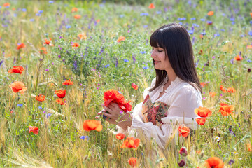 young medieval maid happy on a flower meadow