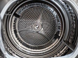 Metal drum inside a washer and dryer