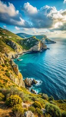 Fototapeta premium A stunning coastal landscape shows a rugged cliffside overlooking a vibrant blue sea.