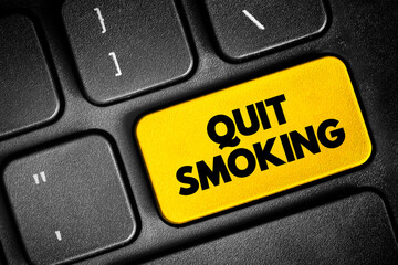 Fototapeta premium Quit Smoking text button on keyboard, concept background