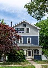 Beautiful Two-Tone Family Home with Navy and Grey Clapboard Siding in Brighton, Massachusetts, USA