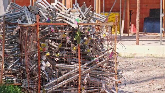 Metal Mesh Backet Full of Construction Site Cuplock Scaffolding Vertical Legs Uprights Metal Elements