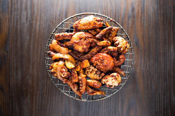 Charcoal Seafood Assortment include shrimp, prawn, calamari, octopus and mussel served in dish isolated on wooden table top view of korean food