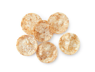 Round brown rice chips, salty crispy snack isolated on white background top view