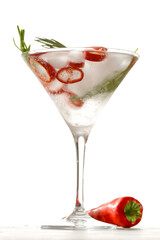 A refreshing cocktail with cold water with ice cubes, hot pepper and rosemary, and free copy space for products. Mocktail on a moody summer day.