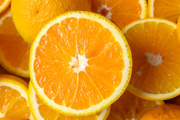 Sliced orange circles, laid on the surface in several layers.
