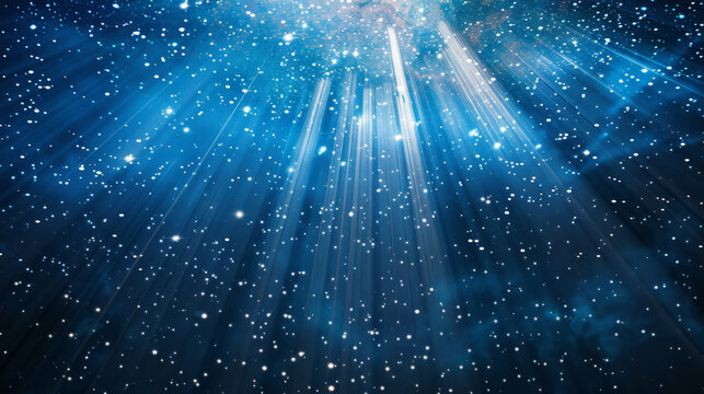 Abstract blue starry sky background with rays of light and stars, glitter effect. Abstract space background with bokeh