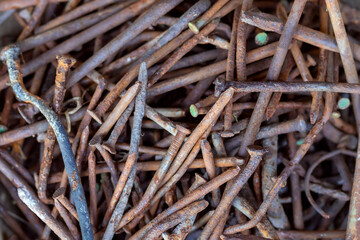 Pile of old Rusty nails close-up. Background old rusty steel nails. metal corrosion.