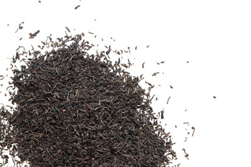 Black long tea on a white background. Top view of dried tea leaves. Tea composition. Ingredients for a hot drink, close-up. Background. Presentation of the type and variety of tea