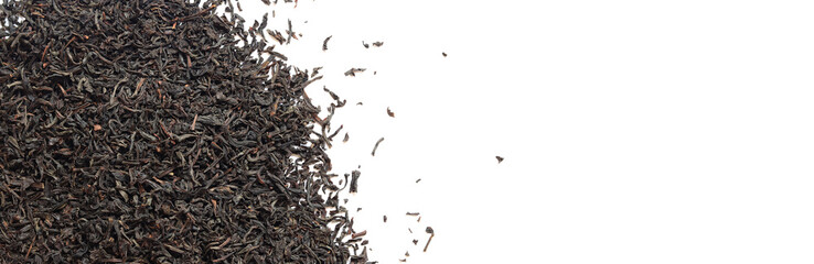 Black long tea on a white background. Top view of dried tea leaves. Tea composition. Ingredients for a hot drink, close-up. Background. Presentation of the type and variety of tea