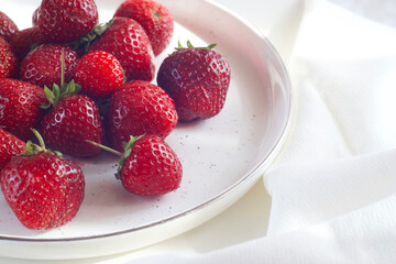 strawberries in a plate on the table