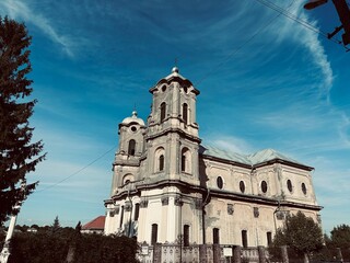 ancient roman catholic church on sky background. Church of the Immaculate Conception of the Immaculate Virgin Mary