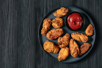 american style fried chicken wings on a plate