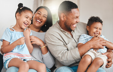 Family, happy and laugh in living room on couch for bonding, relax and retirement together on weekend. Mother, father and children with funny joke in house on sofa for love, care or support as people