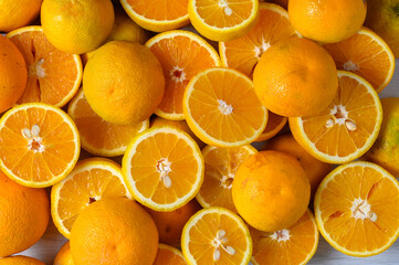 Background of fresh sliced citrus fruits closeup