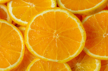 Slices of orange on an orange background