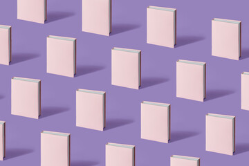 Pattern of pastel pink books on a pastel purple background with soft shadow, copy space. Book...