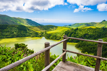 Viewpoint platform at green lake in volcano caldera at Rasa e Funda, Flores island, Azores, Portugal