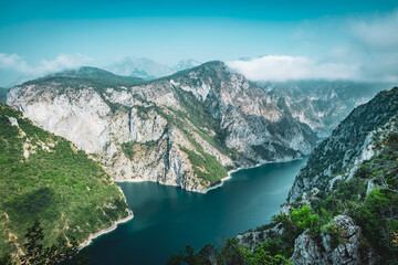 Montenegro mountains with canyon filled with water 