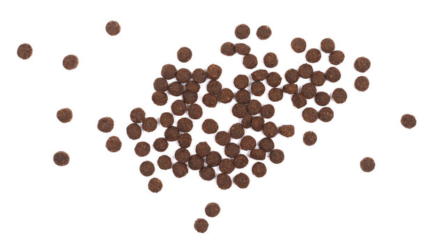 Pile dry dog food isolated on white background, top view